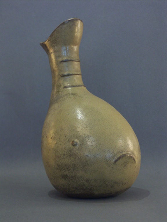 Outstanding example of McVey's work in stoneware, dealing with natural and animalistic forms. The current example being the polliwog or larval frog. Bulbous gourd shape with a mildly distinct mouth and eyes, and three horizontal ridges to the tail