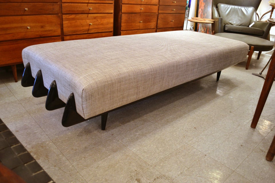 This unique daybed is beautifully carved from end to end.  Recently reupholstered, and ready for your favorite guest.