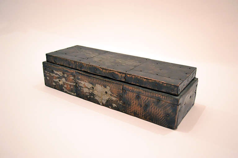 A well executed and designed trinkets box by Paul Evans. The box is comprised of hammered sheets of mixed metal, copper, tin, steel. The metals are burnished and scratched revealing surface texture. The compartments are lined with cork and most