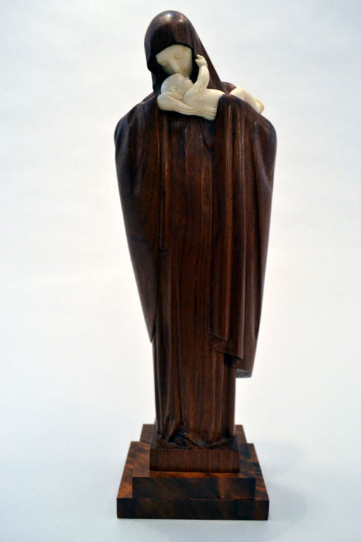 A wonderful sculpture by Lucienne Antoinette Heuvelmans (1885-1945), France c.1920. The sculpture is handcarved walnut and ivory. Heuvelmans studied at the Echole des Beaux Arts. <br />
She was the first woman to win the Prix de Rome.