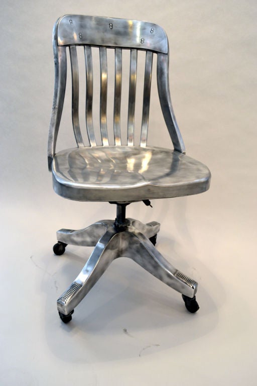Turn of the century aluminum desk chair. Likely made by Goodform Co. 1940's. A great chair for the rustic Modern look.