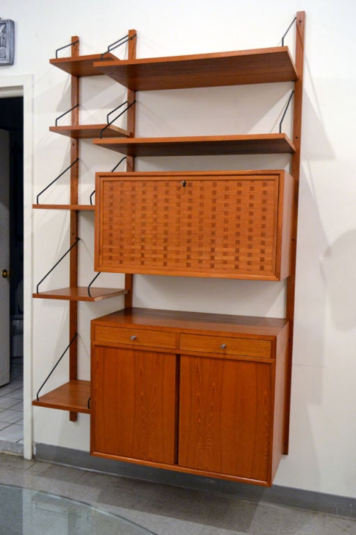 A very functional and adaptable shelving unit designed by Poul Cadovius, Denmark. The Cado System, designed as a multi-functional shelving system, this particular unit has multiple shelves and box storage units for closed storage.