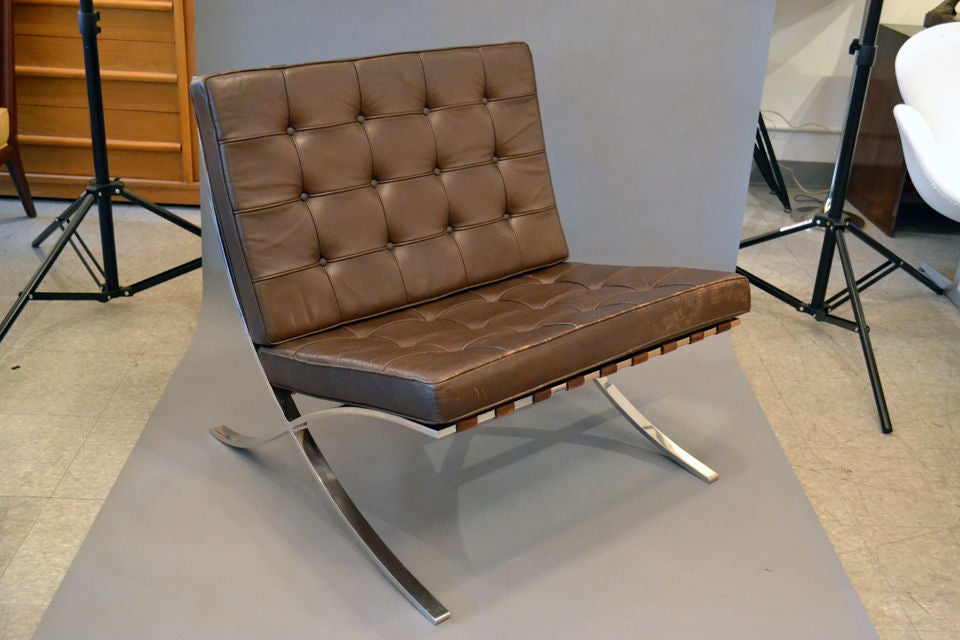 An iconic design by Mies van de Rohe. A wonderful addition for the Modernist home. The leather is a milk chocolate brown with vintage wear. A few straps have been replaced.