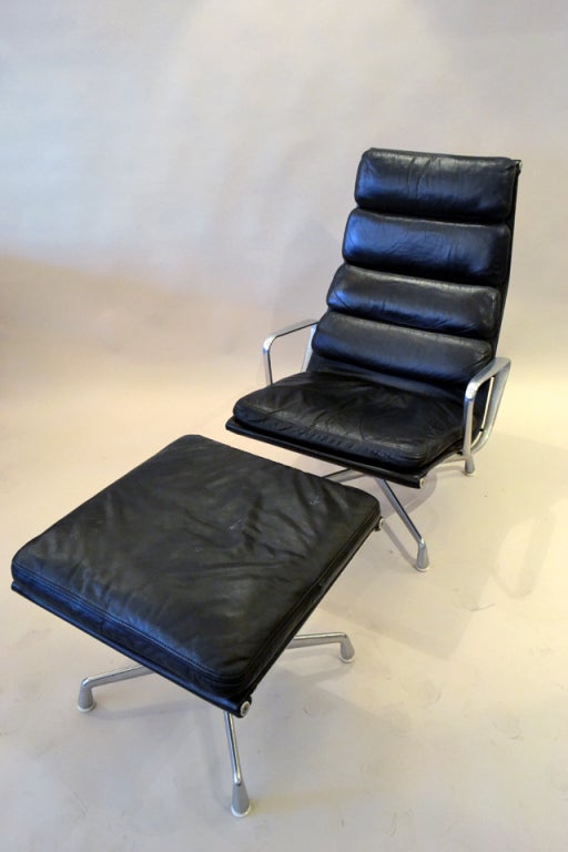 Originally Designed in the 1950's by Charles Eames for Herman Miller, these chairs were produced in the Aluminum Group series. They were later redesigned with the addition of padded cushions, now known as Softpad seating. The chairs are fully