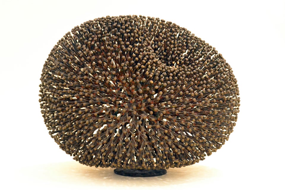 One of the most beautiful sculptural styles of the Post-War era. Harry Bertoia mastered the method of direct metal sculpture. This form comprised of copper stems terminating in bronze buds, evolves from a single stem into thousands of branches. 