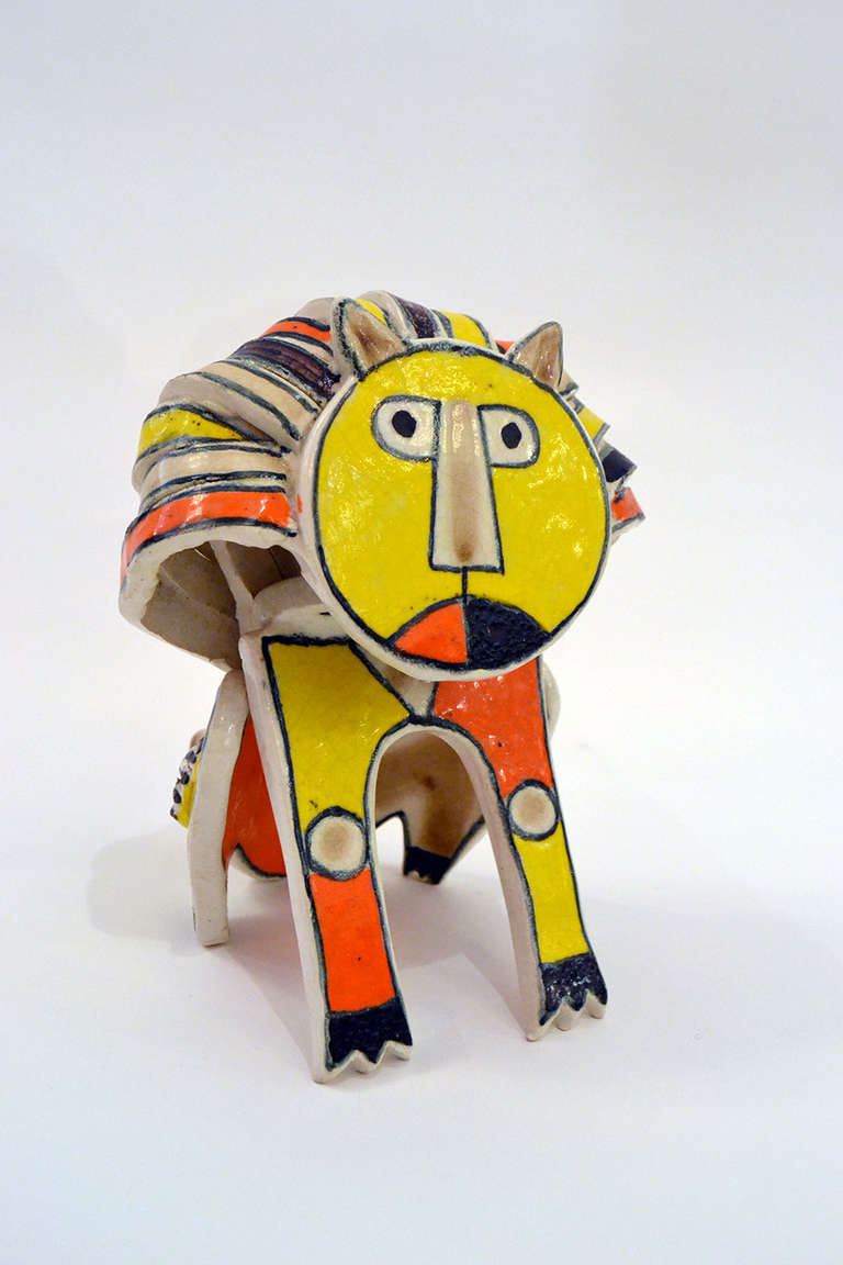 A playful handbuilt ceramic sculpture of a lion by Bruno Gambone. The sculpture is a wonderful example of the Gambone's family traditional of playful ceramics.