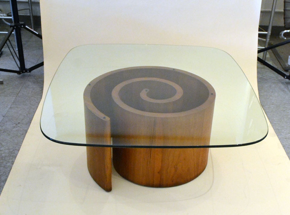 A wonderful walnut cocktail table by Vladimir Kagan. The base is a spiraling formation considered the 