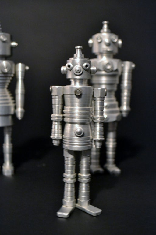 A wonderful group of nine hand turned, hand constructed
robots, made by a machinist. Only seven are pictured, measurements are for the largest figure.