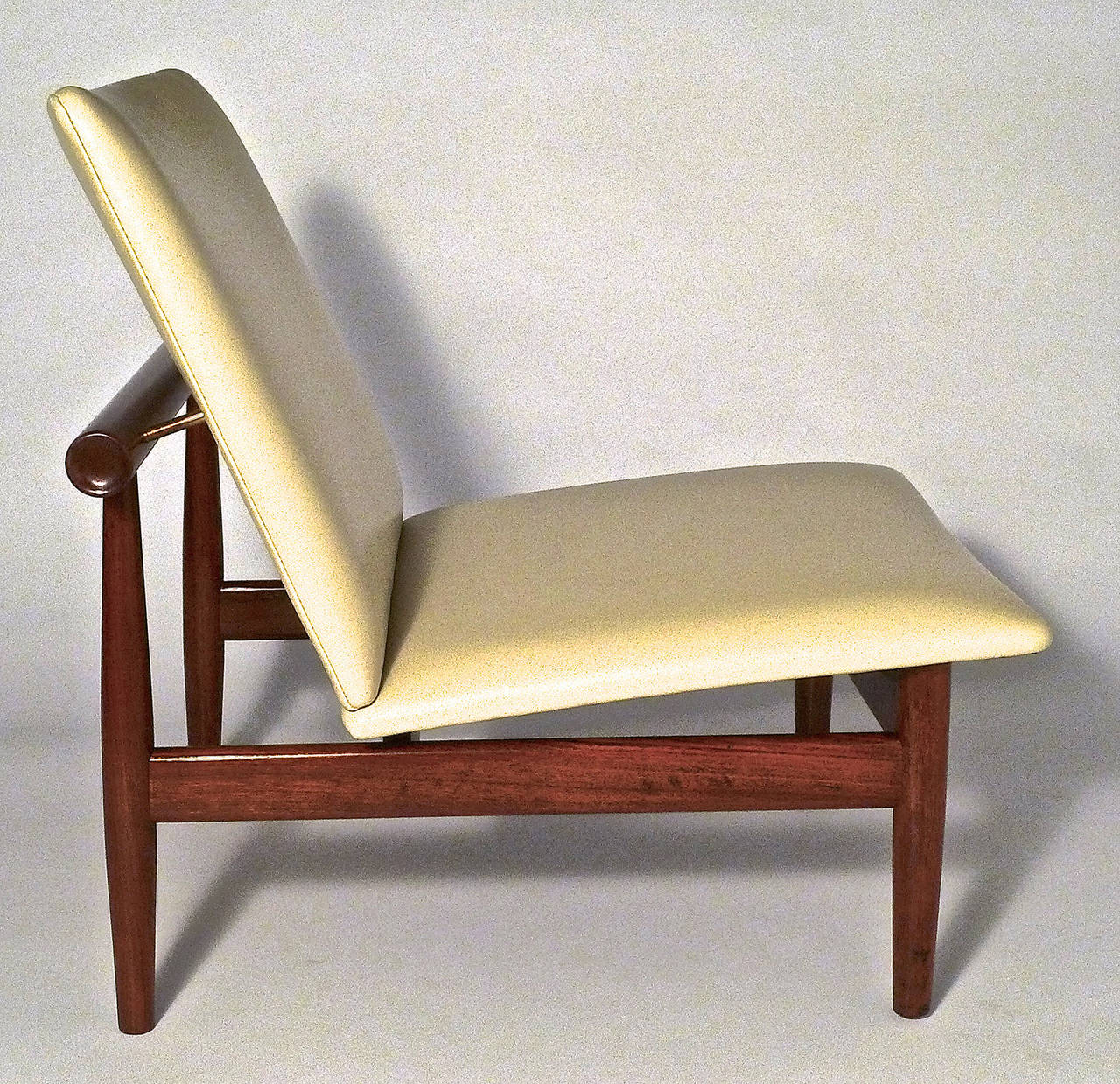 An exceptional pair of chairs by one of the great Danish furniture designers.  They have been reupholstered in leather.