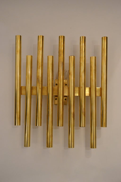 A wonderful pair of 18 candelabra socket sconces by Gio Ponti. The sconces have been polished and rewired. There are also smaller configurations available, please contact for information and sizes.
