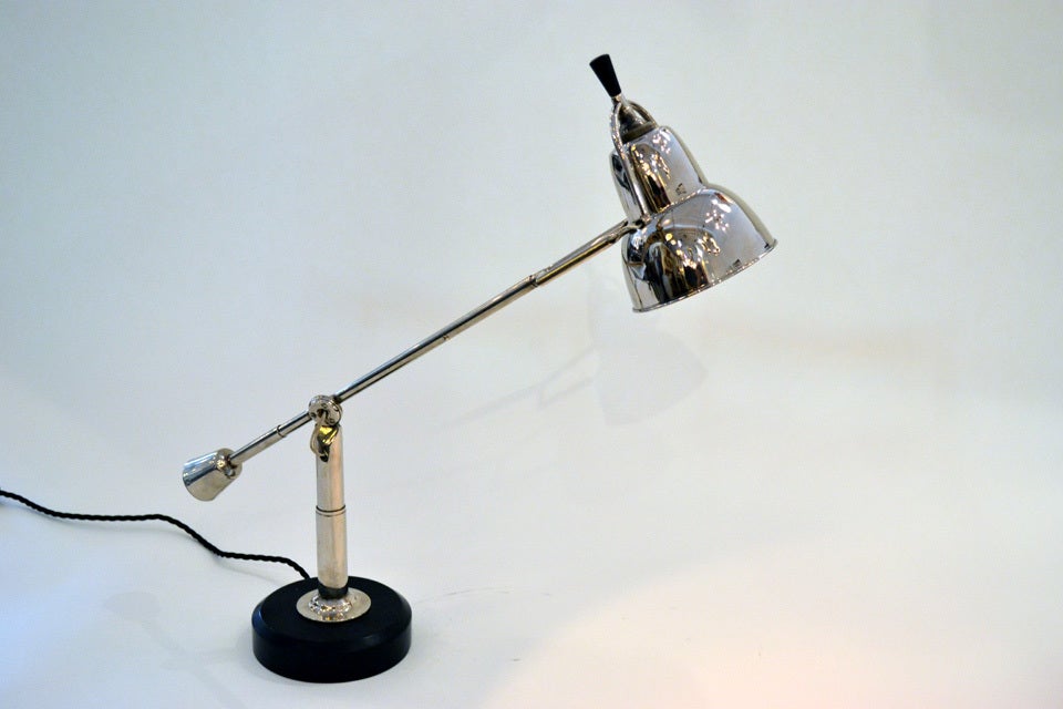 A reproduction buquet desk lamp designed by Eduard-Wilfried Buquet, 1927. A classic and timeless design, chromed brass and wood base, wired with a bayonet socket.