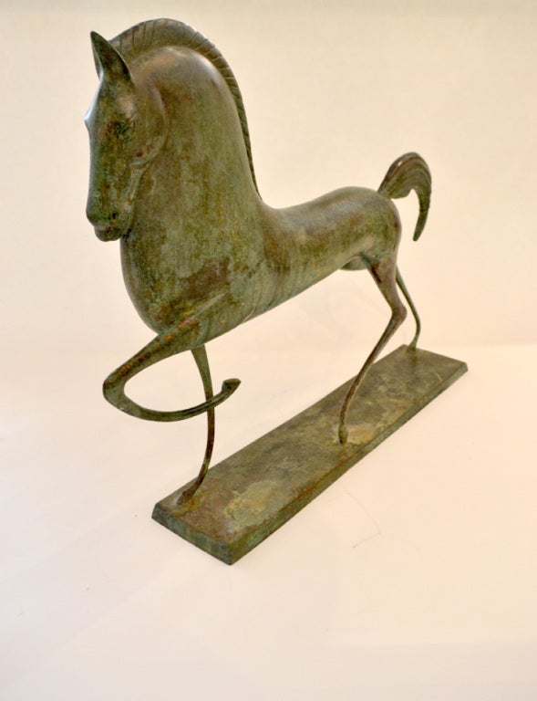 A breathtaking decorative sculpture in the manner of Boris Lovet-Lorski. It has a beautiful patinated bronze finish with great presence and impressive size.