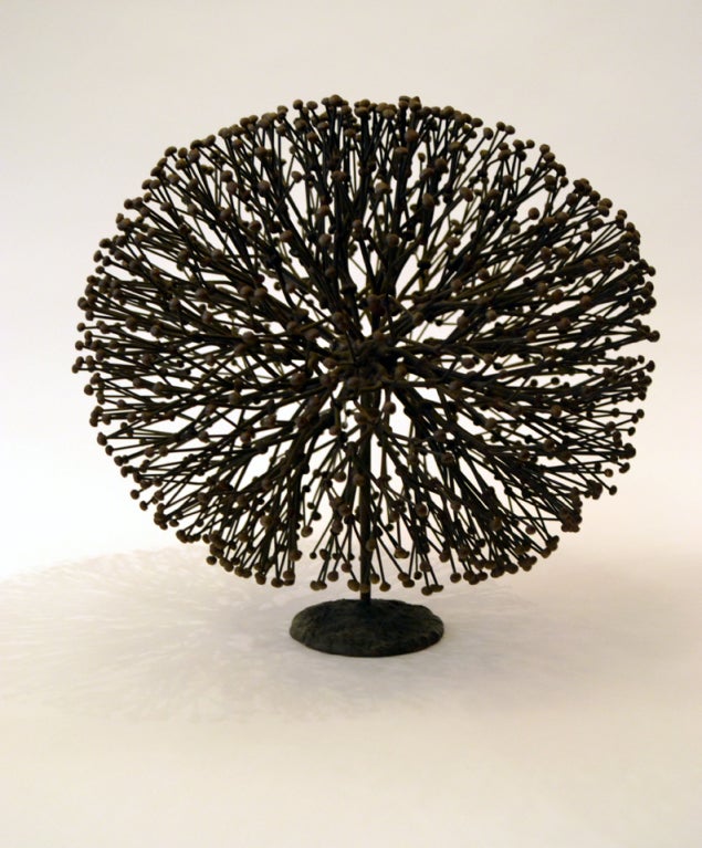 One of the most beautiful sculptural styles of the Post-War era. Harry Bertoia mastered the method of direct metal sculpture. This form comprised of copper stems terminating in bronze buds exhibiting Bertoia's mastery of metal in recreating the
