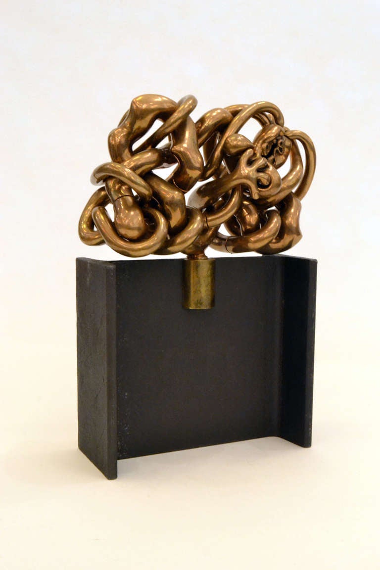 A solid brass sculpture puzzle by Miquel Berrocal dedicated Homage to Picasso. One of the more complex puzzles by Berrocal, this particular one has many twists and folds... a real mind bender.