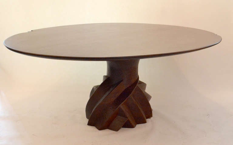 A wonderfully sculpted and highly carved table by Wendell Castle, signed and dated 2000. The majority of the table is carved from mahogany. The top is veneered with an exotic African wood, Pommele Sapele.