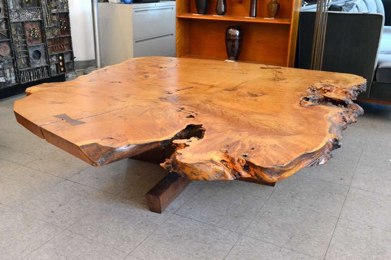 A magnificent and terrifically thoughtful Minguren Coffee Table by George Nakakshima, signed George Nakashima. 1979. The top is made of solid 2' thick Burled walnut. The base and butterfly joints are milled from East Indian rosewood. A very massive