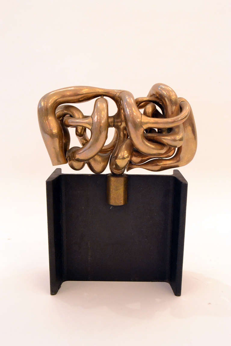 A solid brass sculpture puzzle by Miquel Berroca. One of the more complex puzzles by Berrocal, this particular one has many twists and folds... a real mind bender.