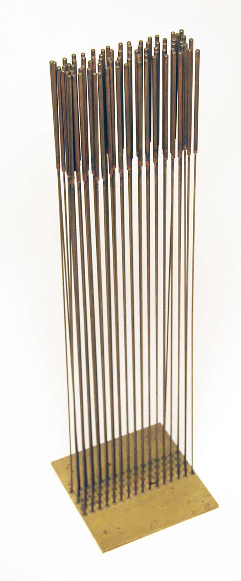 Sound sculptures were the main focus of Bertoia's work in the 1970's.  This is one of his classic forms with beryllium copper rods soldered into a brass base in rows of sixteen rods wide and 5 rods deep.  It has wonderful sounding quality and the