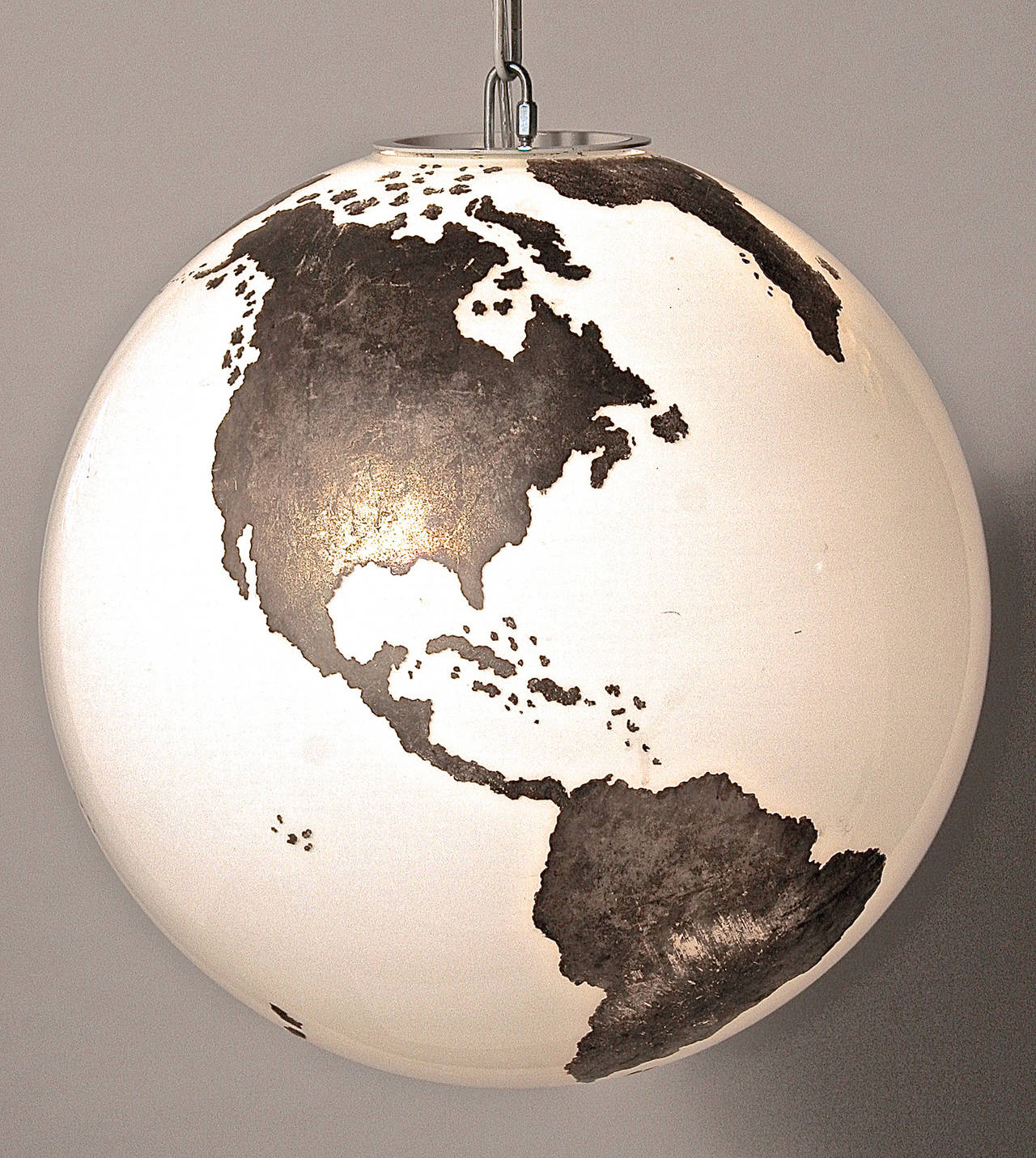 The map is platinum applied to the surface of the glass that has a unique and wonderful character. The price is for one light but there are two available.
