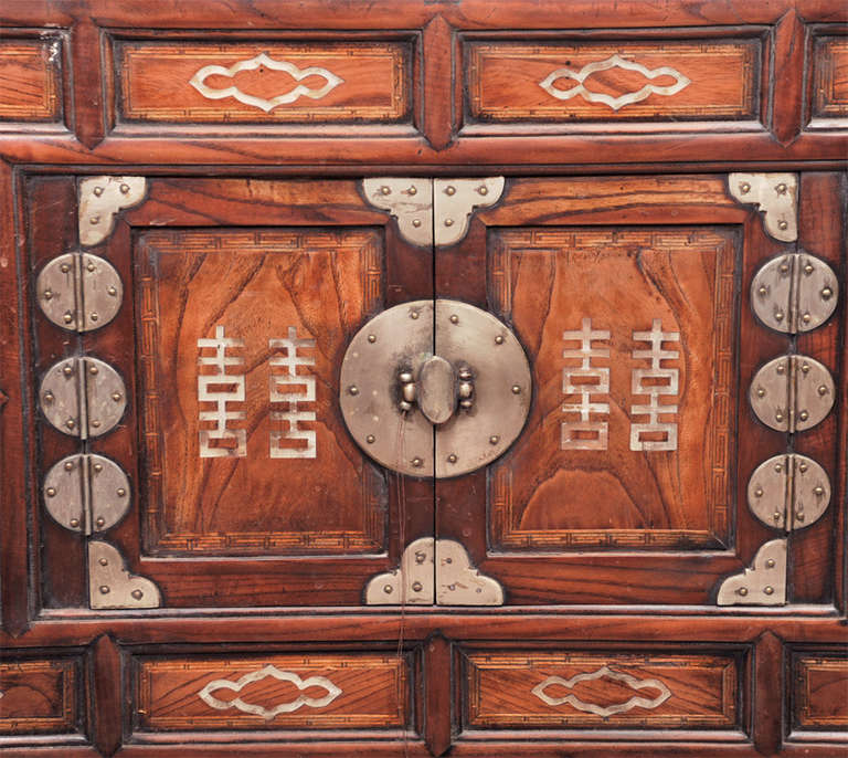 Korean two-level cabinet with white jade inlay and original metal fittings.