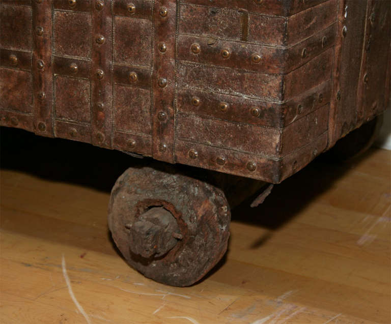 Wheeled teak trunk with original ribbed iron fittings.  Traditionally used as patio storage in Indian havelis.  From Rajasthan, India.