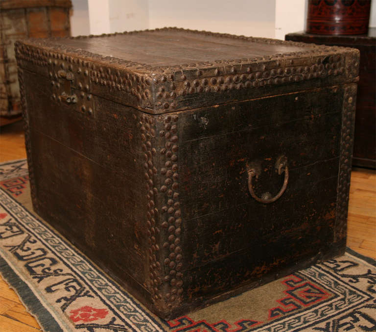 Elmwood trunk with original iron studding and fittings.  For more photos, contact dealer.