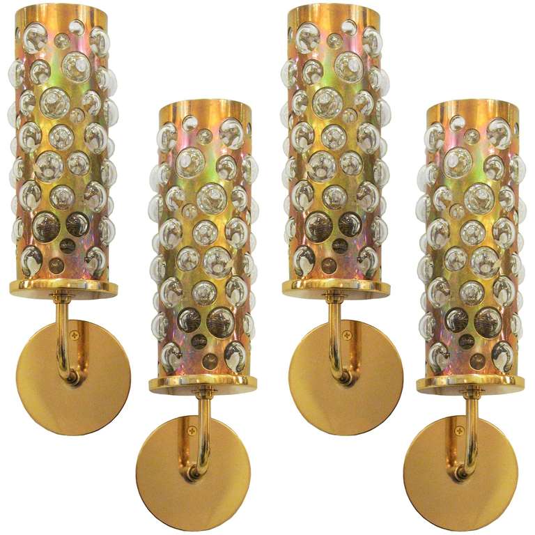 4 cylinder sconces in brass lined with glass protruding bubbles, Italy, ca. 1960.
Newly rewired with 1 candelabra socket.

Sold by pairs.