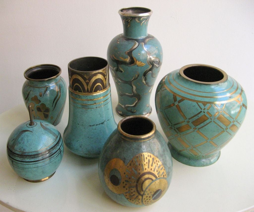 Collection of vases in metal done in the French technique of 