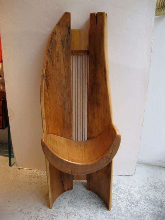 Organic sculptural chair with asymmetrical form carved from pequi tree, Bahia, Brazil, circa 2000.