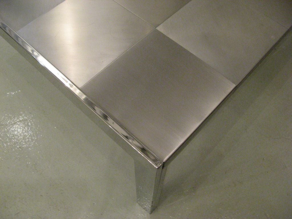 Coffee table with stainless steel squares in a grid patchwork arrangement, supported on a chromed steel base by Ross Littell for ICF, Italy, c. 1967.