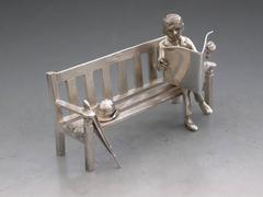 Modern Silver Model Gentleman Sitting on a Bench "Calcutts Panel, 1800 Bids"