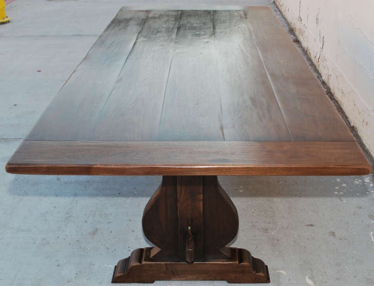 Vintage black walnut dining table. As shown this table measures 112 in. x 44 in. expanding to 136 in.

Note that the Cello shaped legs and stretcher allow this table to be completely collapsible!

Because each table is bench-made in our own Los