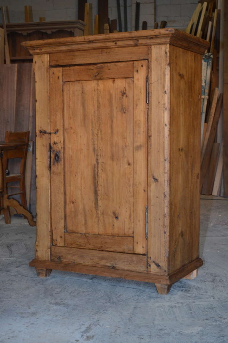 Charming rustic cupboard in pine, circa 1850. Shelves included upon request.
