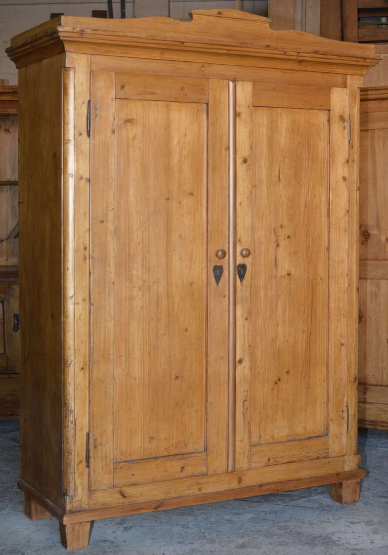 Great armoire with heart-shaped escutcheons. Original shelves and hanging pegs. Great patina!!