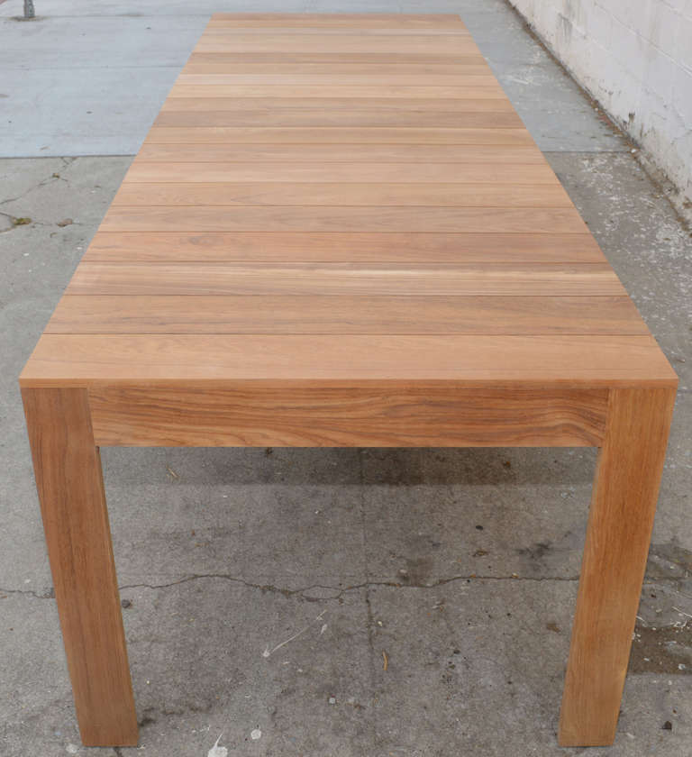 This versatile, teak dining table can be expanded from 120 inches to 144 inches in length.

As shown: 120 inches x 39 inches, expanding to 144 inches.

Because each table is bench-made in our own Los Angeles workshop you can influence all aspects of