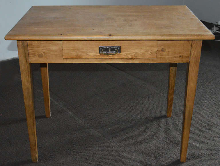 Farm table with a single drawer.