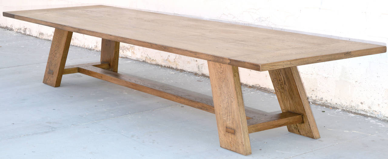 Solid, reclaimed white oak dining table with a modern flair. Will seat 14 as shown. Legs splay in both length and width.

Because each table is bench-made in our own Los Angeles workshop you can influence all aspects of design, including size, wood