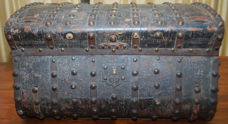 This most unusual chest was intended for travel under rough conditions, such as by stagecoach in the Old West. It is extremely sturdy! Clad in steel and leather with brass rivets all around. 
    This is definitely a 