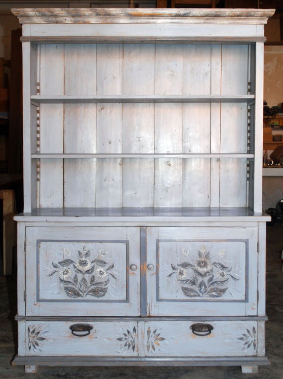 Folk Art painted step back hutch with adjustable shelves, two drawers and two doors. Could be used to hold a flat screen TV that is less than 49