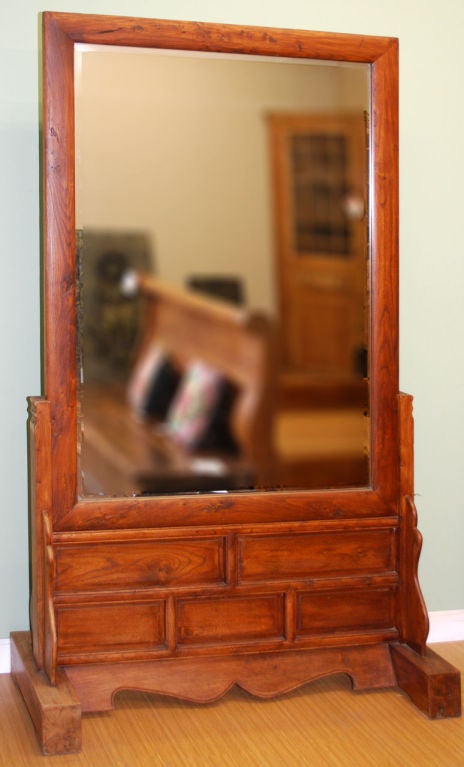 Great mirror in solid elm. Identical on both sides! The mirror glass has been recently replaced on both sides and has a 3/4 inch bevel.
