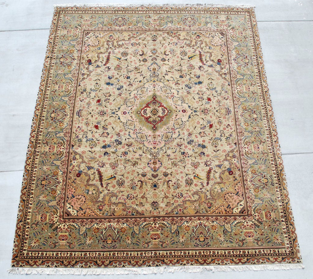 Very fine hand knotted Tabriz rug in perfect condition. Please note the vivid colors and detailed pattern on an Ivory background. 