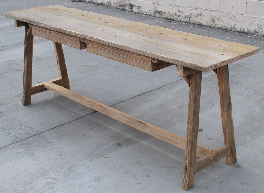 Primitive table in vintage fir with great patina. Legs are splayed in both length and width axis. Has two large drawers.

We can reproduce this table to desired specifications.

