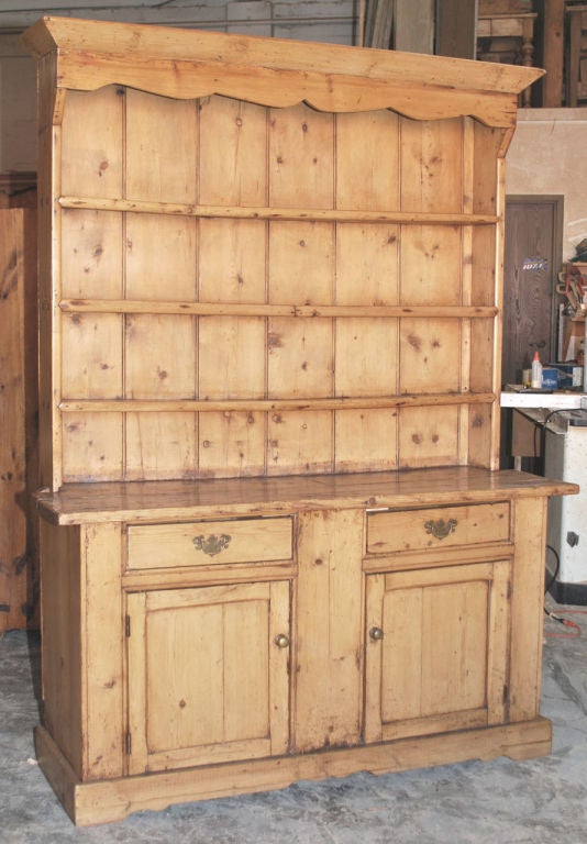 Irish Dresser from County Mayo with traditional Cupid's Bow details. Original wide boards back the plate rack with shelves showing through tenon construction. A very nice, early piece!