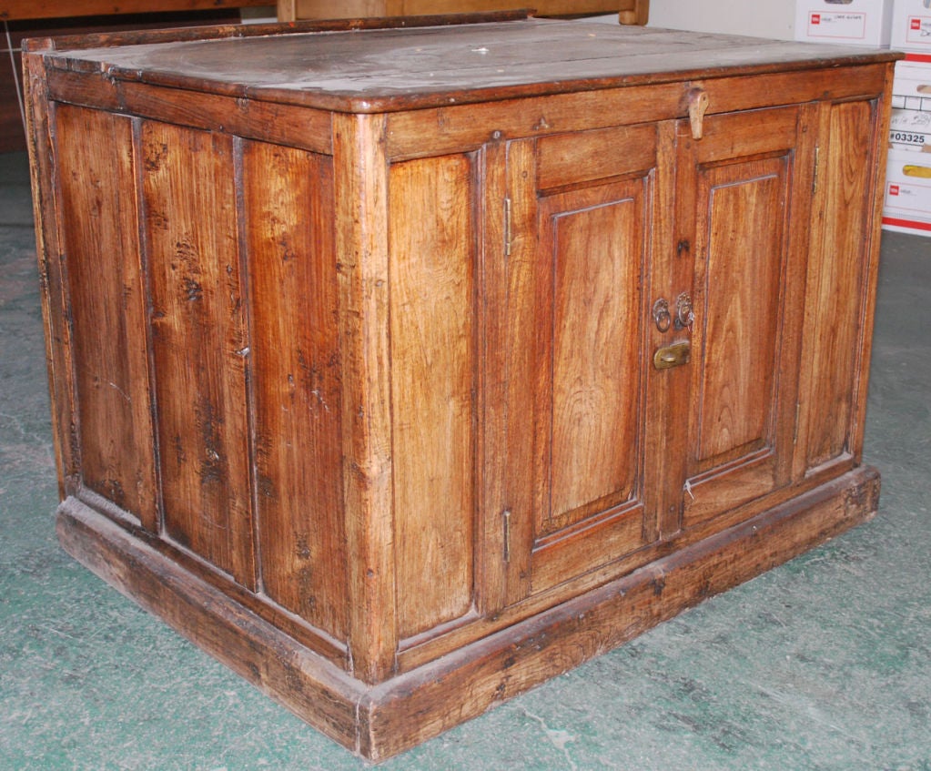 British colonial cabinet with two doors and interior shelf. Could work as bathroom vanity.