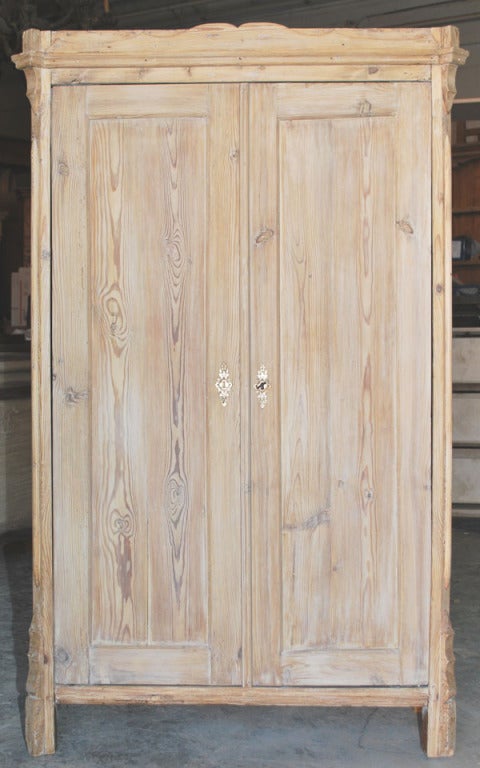 Small armoire with interior shelves, working lock. Well built with mortise and tenon construction, beveled floating panels. Interesting gray caste.