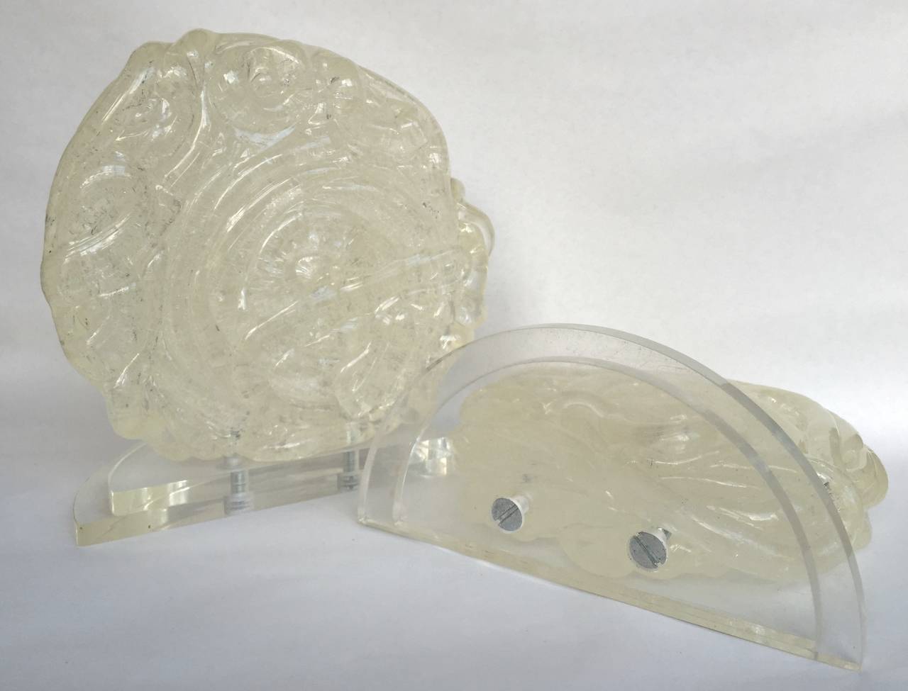 Hand-formed sculptural twists of Lucite rod form a heavy Baroque disk mounted on a stepped clear Lucite base, American, 1950s.