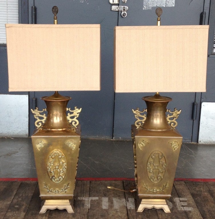 Large hand-made square brass vase-form lamps with cast and chased ornamentation. Great patina, custom beige silk tweed shades. Hong Kong, late 1960s. Lamp bodies 9