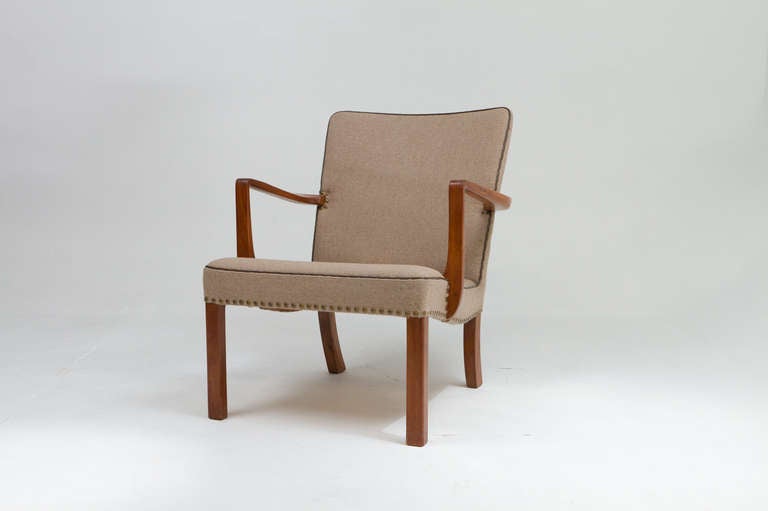 A fine mahogany and fabric arm chair designed and made by Jacob Kjaer.  See image of the original bill of sale.