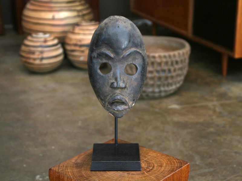 From Côte d'Ivoire or Ivory Coast, in West Africa, this Dan Mask from circa 1910 has round eyes and protracting lips. The large round eyes suggest that it was used for sport racing and possibly was a portrait of the tribal chief's favorite wife.<br