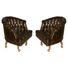 Pair of original leather tufted rolling lounge chairs